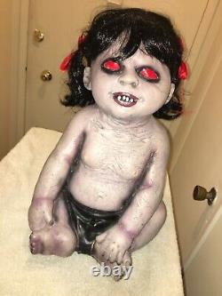 Halloween prop FEMALE ZOMBIE BABY Lights and sounds. Retired. SOLID COND