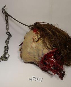 Marilyn Manson Prop Severed Bloody Heads on Meat Hooks