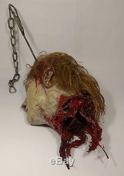 Marilyn Manson Prop Severed Bloody Heads on Meat Hooks