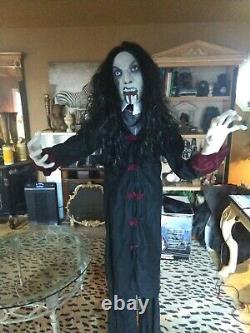 Spirit Halloween Life Size Props White Witch and Black Vampire Light Up Eyes